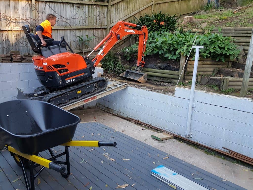 mini excavator on ramp