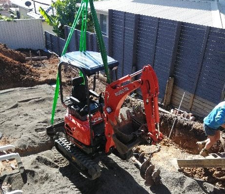 excavator being craned